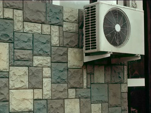 Air conditioner on the ventilated facade of the house