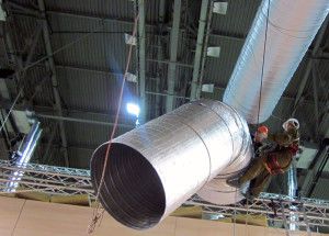 large air ducts are lifted with cranes